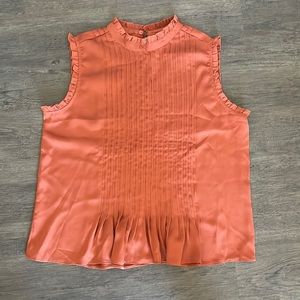Rust colored professional sleeveless blouse
